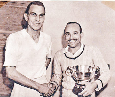 NEW KING OF SQUASH: Hashim Khan (right) shakes hands with Egypt’s Mahmoud El Karim after winning the final of the British Open in 1951