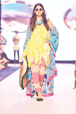 Ather Hafeez for Sana Safinaz Collection: Venue: French Beach Karachi Ather Ali Hafeez shifted from Lahore to Karachi and has been working with Sana Safinaz for several years now. His aesthetic is evident in the ready to wear range that has more ethnic and cultural referencing than the brand Sana Safinaz ever had. This kaleidoscopic collection may not have been very Autumn/Winter but it was the perfect combination of Ather's bohemian spirit and Sana Safinaz's easy chic. It pelted out separates that were spirited and showed strength of character on the women wearing them. Not easy to carry by all, the silhouettes guaranteed individuality and originality to women who choose to be different. Key trends: Multi-layering of colour and fabric, shades of black, turquoise, orange and pink with a variety of prints that fall in coherent balance. 