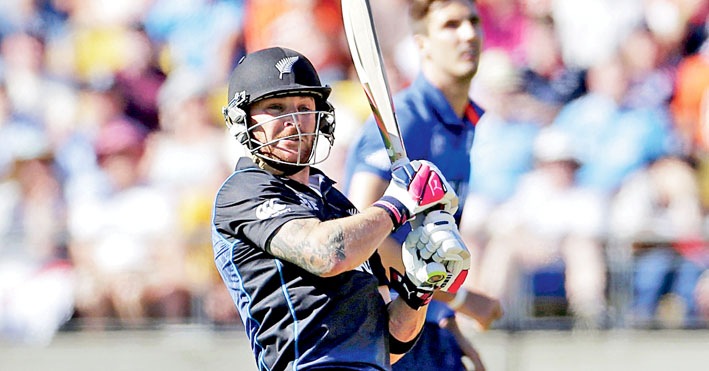 England's Steven Finn reacts after New Zealand's captain Brendon McCullum hit a boundary during their Cricket World Cup match at Wellington Stadium in Wellington