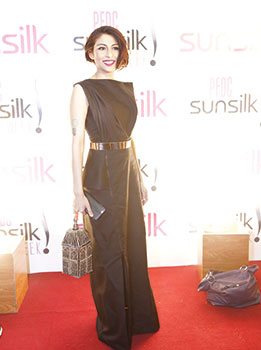 Meesha Shafi The model/actress/singer looked fierce and gorgeous in this structured black gown by Elan. The column dress helps elongates Meesha’s frame, making her appear statuesque and the bold lips and birdcage bag are the only accessories needed to make this look a stunner.