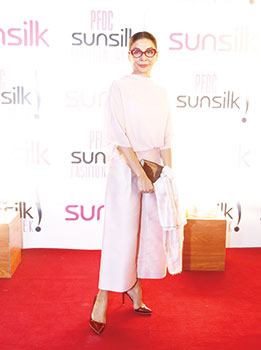 Nabila Refreshing in its simplicity and age-appropriateness, Nabila’s monochrome look stood out amongst a sea of print and colour. The pale pink silk culottes are bang on trend, the sheer top is elegant and the slicked-back hair, killer heels and statement frames add just a hint of drama.