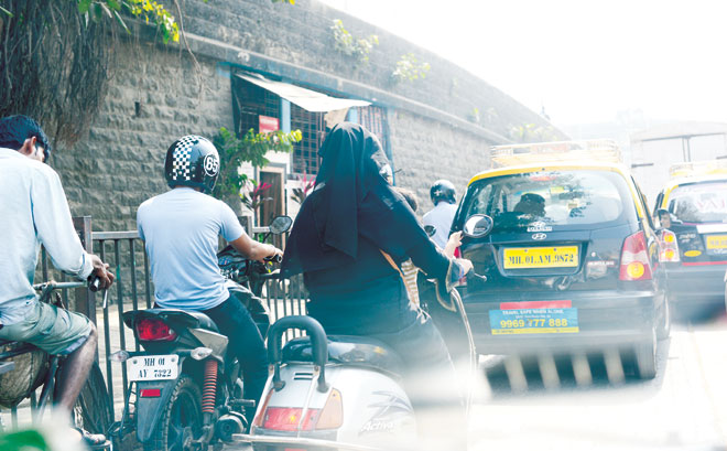 Progressive India: It’s not uncommon to see a fully veiled woman riding a motorbike or scooter on the busy roads.