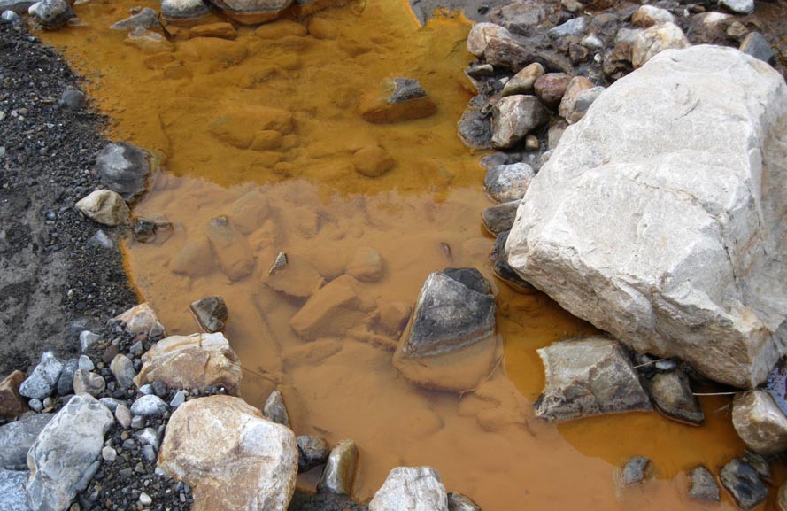 Orange-Yellow coloured water pool due to minerals in the water.