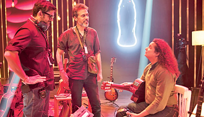 (Above)  Mekaal Hasan on set of Coke Studio 8; (Below) Javed Iqbal and Strings discuss musical notes.