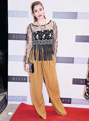 Who: Syra Shehroze Where: Meher Najeeb salon launch, Karachi Forever branded cute, Syra Sherhroze breaks out of the cute-territory and experiments with her look here. Her palette may be more autumn than summer but we cannot fault the top bordered with long tassles. Replete with baggy camel trousers and a dark plum lip, she&rsquo;s sending out a very strong message here. We definitely prefer this to her usual soft and feminine look. - Pic courtesy Catalyst PR 