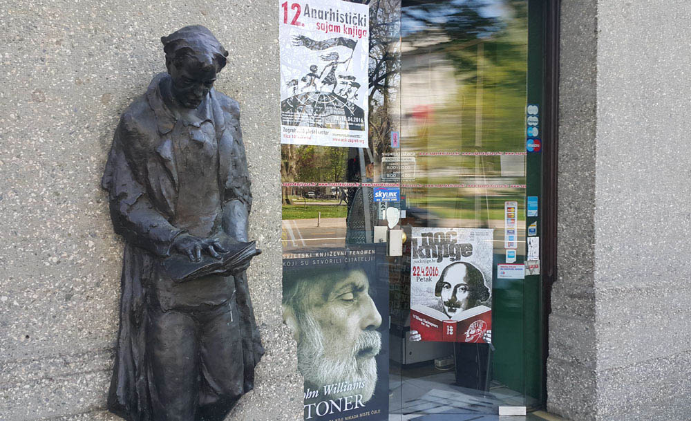 Zagreb's 'forever reader' in stone outside a bookshop.