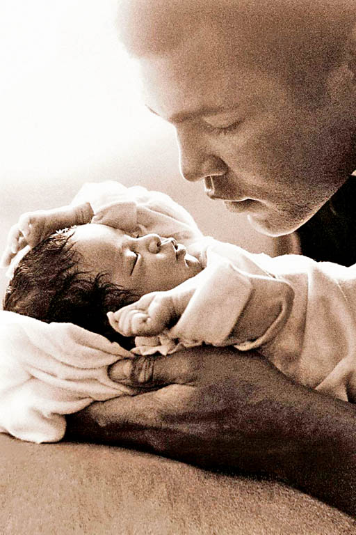 DOTING DAD: The Champ holds two-and-a-half-year old Laila ahead of a fight against Leon Spinks in 1978.