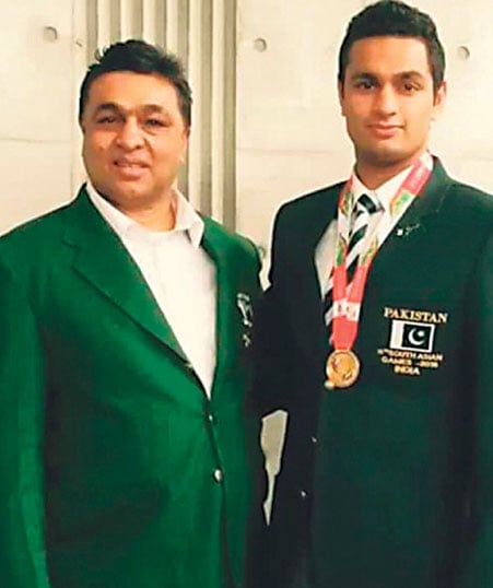 Hussain Shah (L), with his son (R).