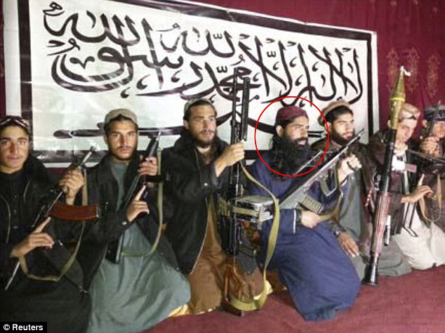 Khalifah Omar Mansoor with the killers at APS