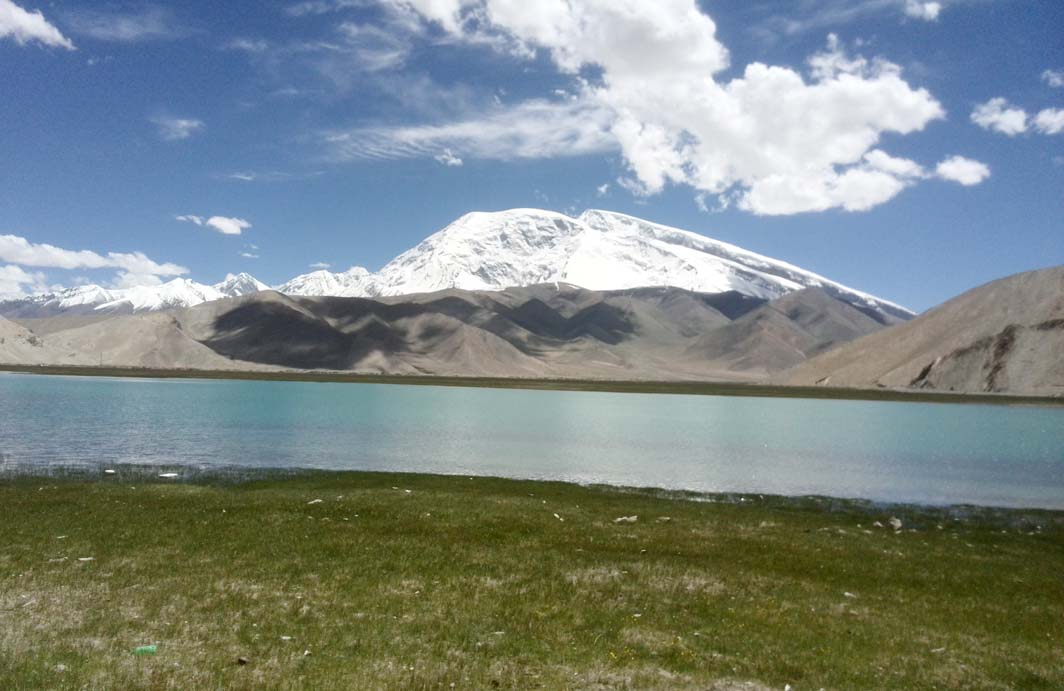 24,780 ft high Muztagh Ata with Lake Karakul in foreground.