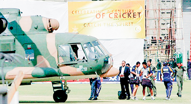 Darkest hour: Sri Lankan players prepare to board a Pakistani military helicopter at the National Stadium in Lahore following the terrorist attack on March 3, 2009