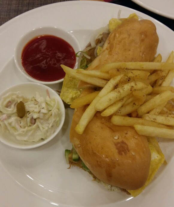 Shami Burger, basted with mint chili sauce, and topped with omelet, came with fresh salad and fries.  