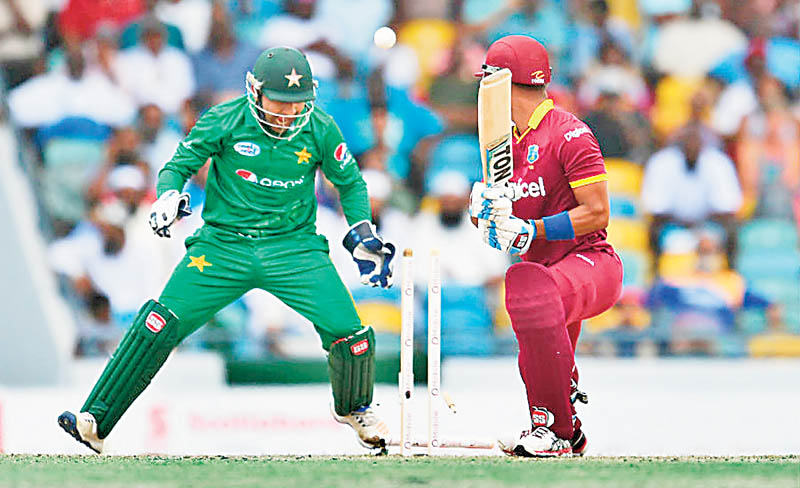 Bamboozled: West Indies&rsquo; Lendl Simmons drags one back onto the stumps off Shadab Khan in the first T20 International on March 26, 2017