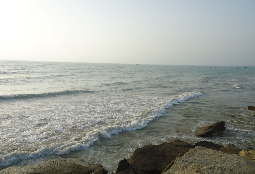 The inspiring calmness of the sea from afar, and the murderous dash of incoming waves.