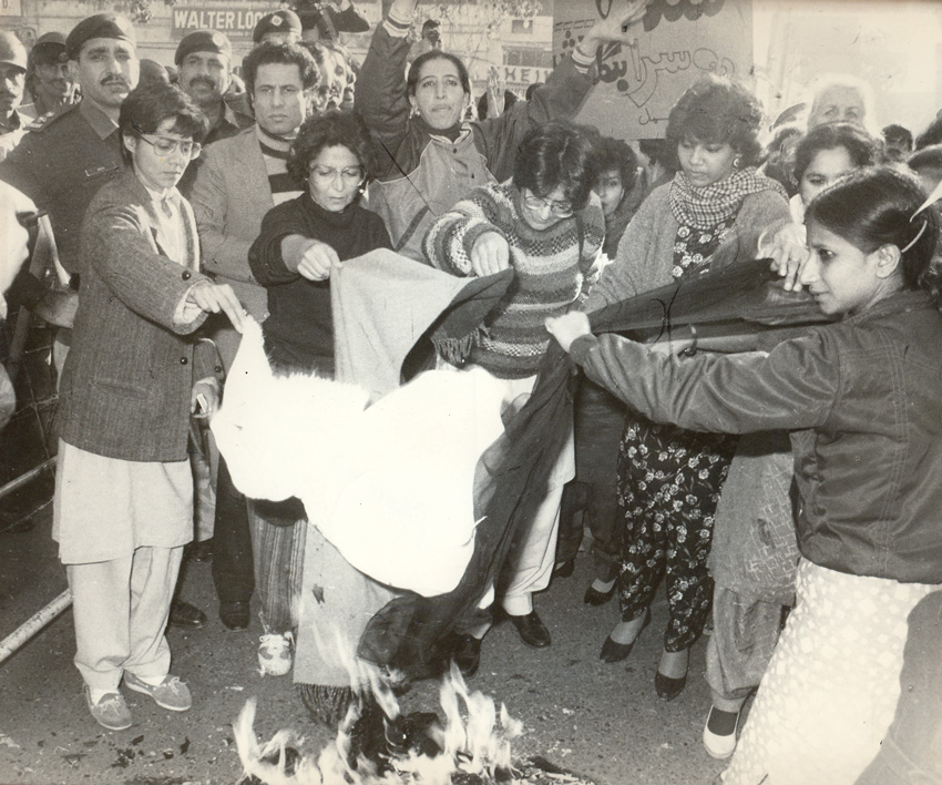Lala Rukh (far left) burning a chador during a demonstration organized by the Women's Action Forum in Lahore, 1987, in protest of the killing of two sisters ..