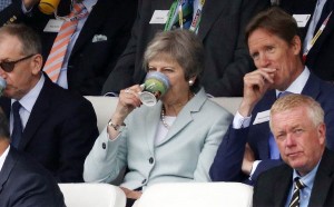 Theresa May enjoying a drink on the second day of the test match. 