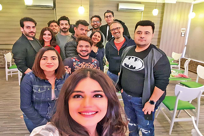 Behind the scenes: Zara Noor Abbas with the cast and crew of Parey Hut Love, which is directed by Asim Raza and is scheduled to release on Eid ul Azha this year. 
