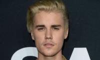 Australia charges Bieber impersonator with more than 900 child sex offences