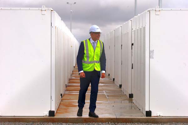 South Australian Premier, Jay Weatherill walks around the compound housing the Hornsdale Power Reserve, featuring the world's largest lithium ion battery.