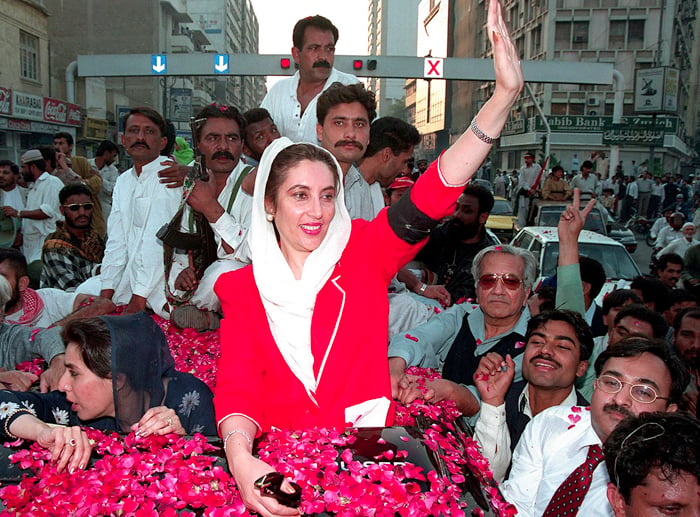February 8, 1999: Benazir Bhutto waves to her supporters in Karachi