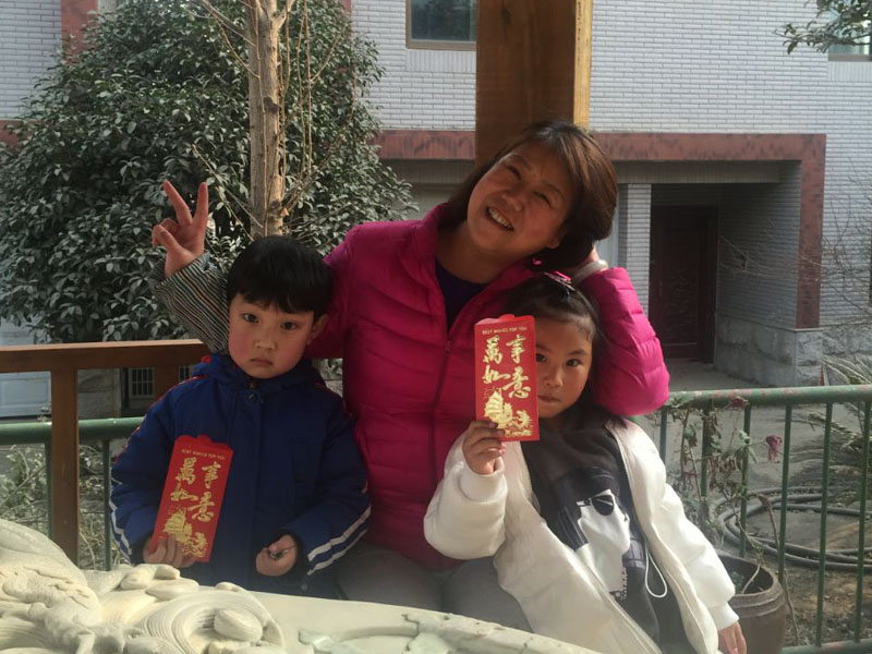 Ms Hanna with her grandchildren celebrating Spring Festival in Ankand city, China.