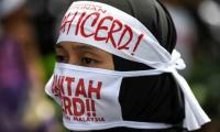 Muslims rally to defend rights in multi-ethnic Malaysia