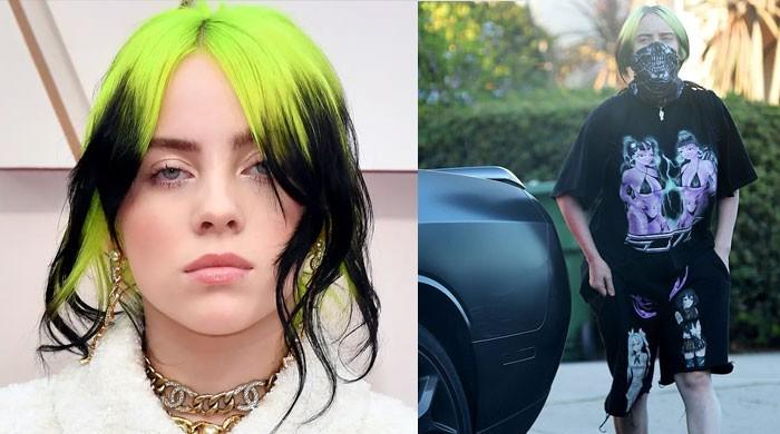 Billie Eilish steps out in black shirt with two bikini clad women on ...