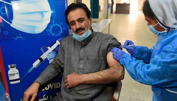 A doctor receives a dose of the Chinese-made Sinopharm COVID-19 vaccine at a vaccination center in Quetta, Pakistan, on February 3, 2021. — AFP/File