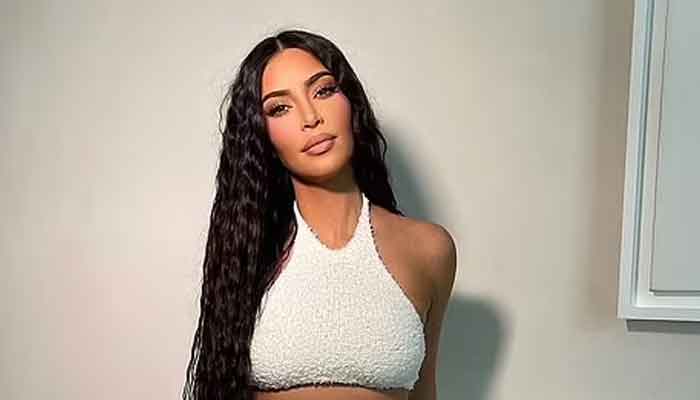Kim Kardashian sets pulses racing as she flaunts her killer curves in figure-hugging outfit