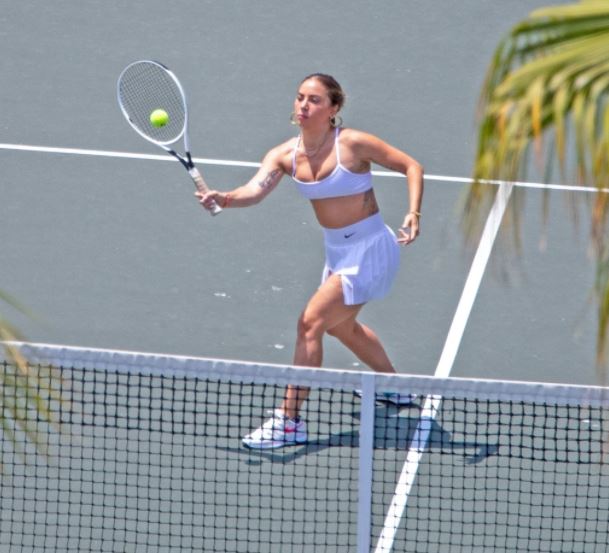 Lady Gaga glams up for tennis lessons on romantic trip with boyfriend