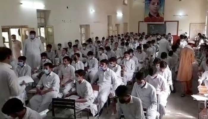 Students waiting for paper to start at an examination centre  in KP. Photo Daniyal Aziz
