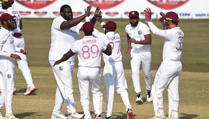 The West Indies Test team celebrating after taking a wicket. — CWI