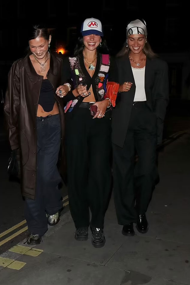 Dua Lipa steps out with Bella Hadid and her boyfriend Marc Kalman during a night out