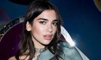 Dua Lipa steps out with Bella Hadid and her boyfriend Marc Kalman during a night out 