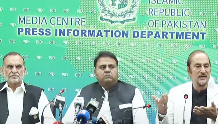 Railways Minister Azam Khan Swati (L) Information and Broadcasting Minister Fawad Chaudhry (C) and Adviser to the Prime Minister for Parliamentary Affairs Babar Awan hold a press conference in Islamabad on Friday, September 10, 2021. — PID