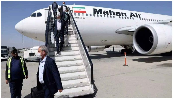 Passengers get off a Mahan Air flight at the airport in Kabul on September 15. Photo AFP