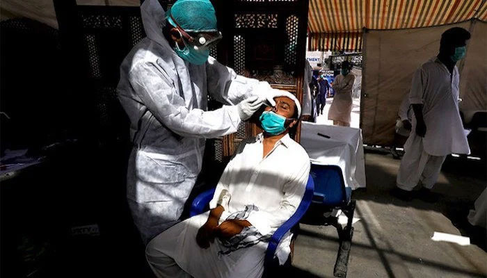 A healthcare worker administering the coronavirus test on a patient. Photo: file