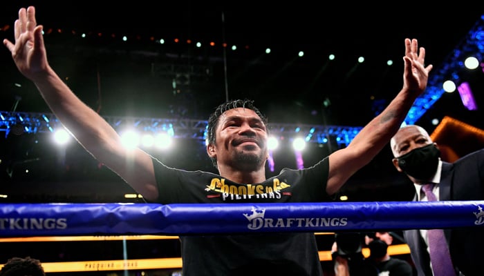This file photo taken on August 21, 2021 shows Manny Pacquiao of the Philippines waving and bowing at the crowd after losing against Yordenis Ugas of Cuba following the WBA Welterweight Championship boxing match at T-Mobile Arena in Las Vegas. — AFP