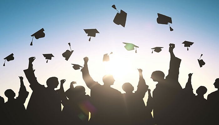 Illustration showing students tossing their mortarboards in the air after graduating — Facebook