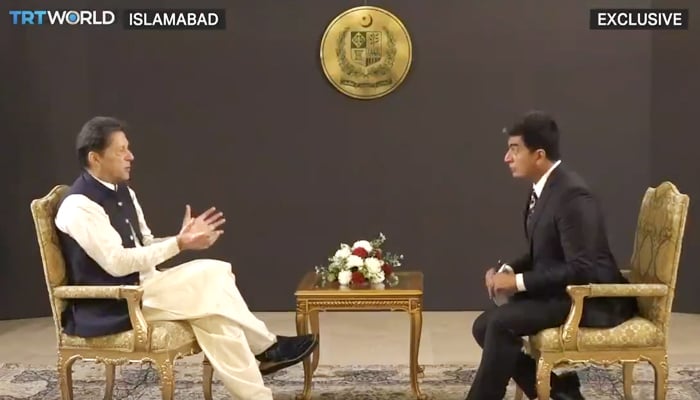 Prime Minister Imran Khan (L) speaking to TRT World journalist Ali Mustafa, in Islamabad, in interview published on October 1, 2021. — Photo courtesy TRT World