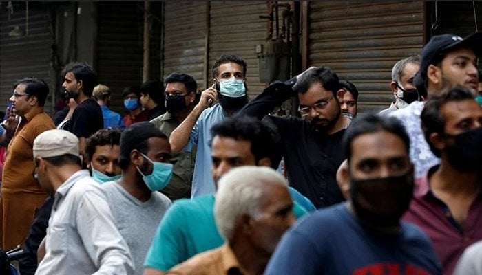People wearing face masks photographed in a market somewhere in Pakistan. Photo: file