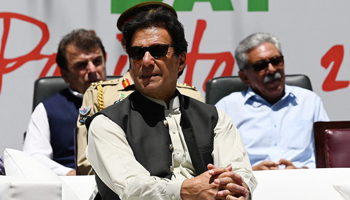 Prime Minister Imran Khan (C) attends an event after planting a tree during his visit to inspect the progress of 10 Billion Tree Tsunami campaign in Makhniyal area of Haripur district, in northwest Khyber Pakhtunkhwa on May 27, 2021. — AFP/File