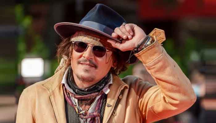 Johnny Depp cuts a dapper figure during a promotion of his new TV series Puffins