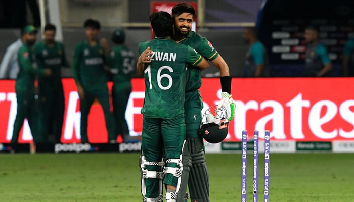Pakistan´s captain Babar Azam (R) and his teammate Mohammad Rizwan celebrate their win in the ICC T20 World Cup cricket match between India and Pakistan at the Dubai International Cricket Stadium in Dubai on October 24, 2021. —AFP