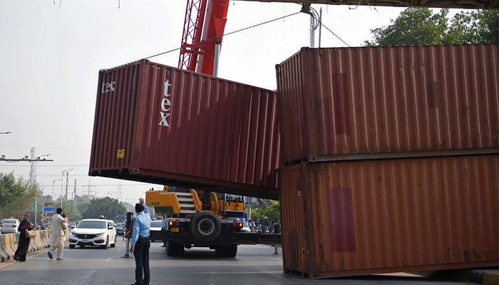 The Islamabad district administration places containers at various roads to stop the expected long march of a banned outfit. Photo: file