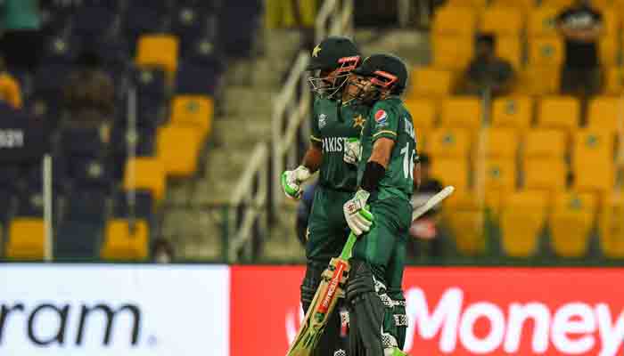 Pakistans captain Babar Azam (L) is greeted by teammate Mohammad Rizwan after scoring a half-century (50 runs) during the ICC Mens Twenty20 World Cup cricket match between Namibia and Pakistan at the Sheikh Zayed Cricket Stadium in Abu Dhabi on November 2, 2021. -AFP