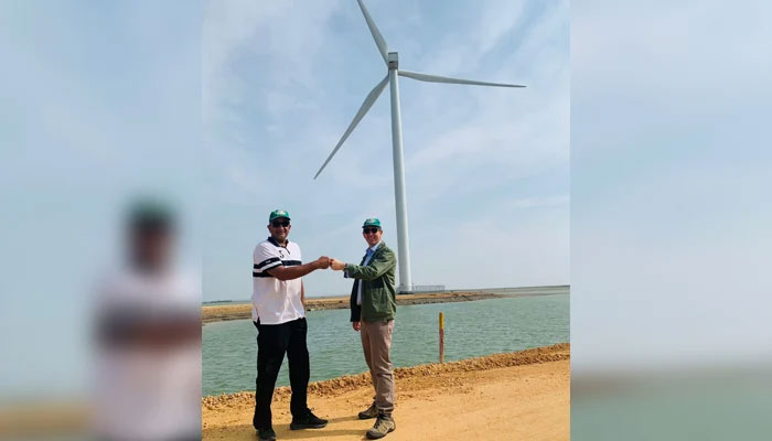 Federal Minister and Adviser to Prime Minister of Pakistan for Climate Change Malik Amin Aslam (L) with UK High Commissioner to Pakistan Dr Christian Turner (R) at the Zephyr Wind in Gharo, which is partly funded with UK capital. — UK High Commission to Pakistan