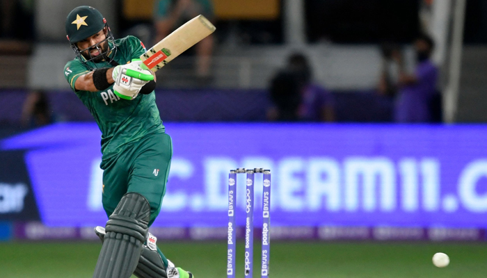 Pakistans Mohammad Rizwan plays a shot during the ICC Twenty20 World Cup semi-final match between Australia and Pakistan at the Dubai International Cricket Stadium in Dubai on November 11, 2021. — AFP