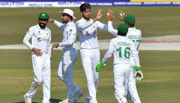 Pakistan´s Shaheen Shah Afridi (C) celebrates with his teammates after taking five wickets on the fourth day of the first Test cricket match between Bangladesh and Pakistan at the Zahur Ahmed Chowdhury Stadium in Chittagong on November 29, 2021.-AFP