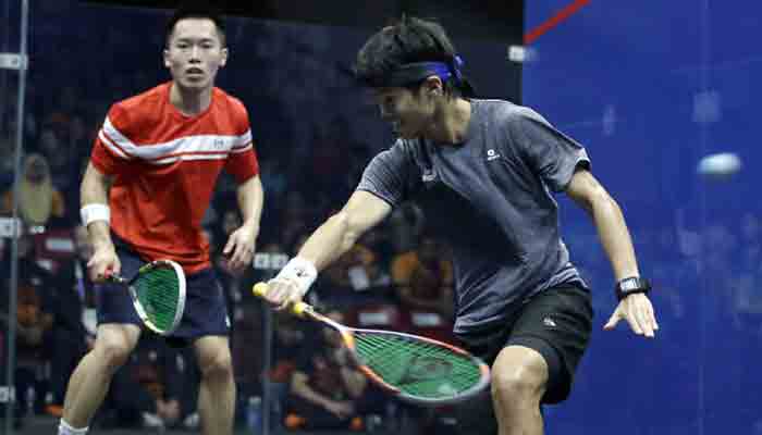 Malaysias Ng Ean Yow, right, and Hong Kongs Au Chun Ming during the mens team squash final match at the 18th Asian Games in Jakarta, Indonesia, September 1, 2018.-File photo